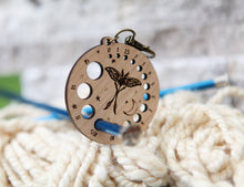 Load image into Gallery viewer, Luna Moth Knitting Needle Gauge in Cherry with Bronze Clasp