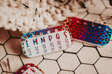 Load image into Gallery viewer, Crochet Hook Minder Set, Hook Size Reminder Stitch Markers: Rainbow Cheetah / Set of 3 - 1 each size
